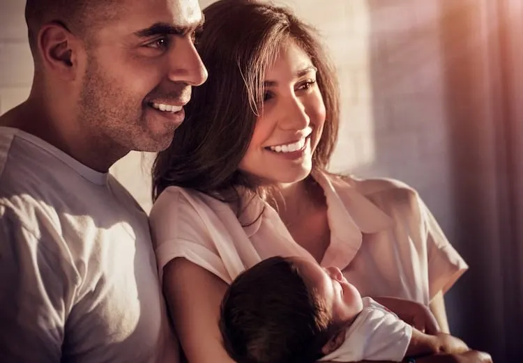 A young Arab couple with a baby