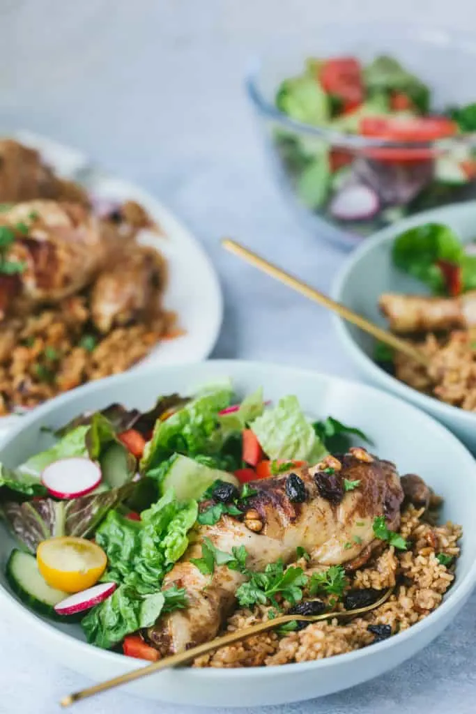 A dinner table with Saudi Arabian chicken kabsa