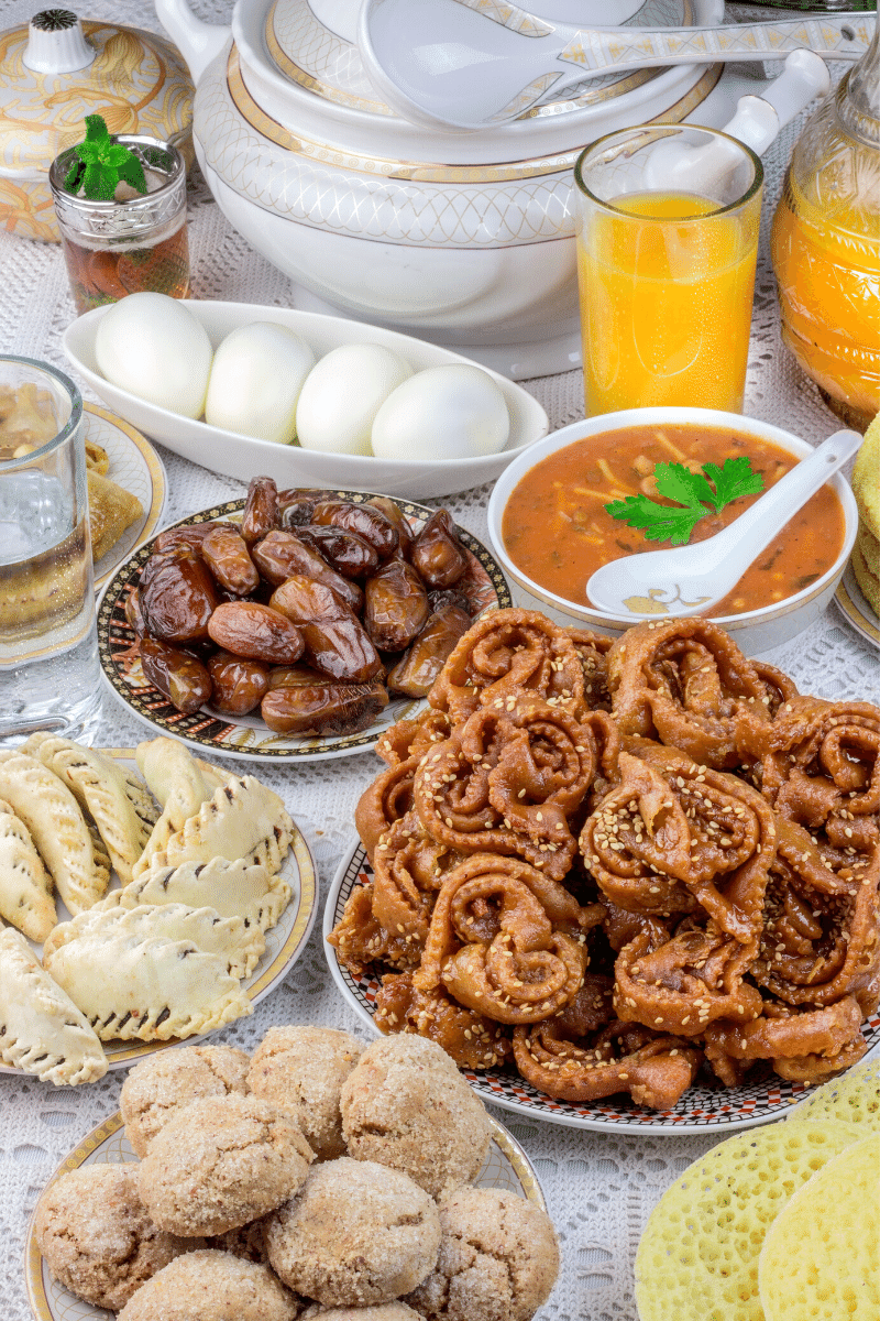 Table of different Ramadan foods with harira, chbekia and ghriba