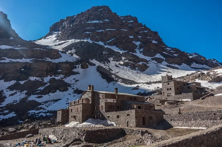 Toubkal national park in springtime with mount, cover by snow and ice, Refuge Toubkal, start point for hike to Jebel Toubkal, – highest peak of Atlas mountains and Morocco