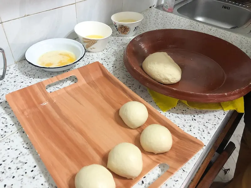 Forming dough balls for Msemmen batbout.jpg