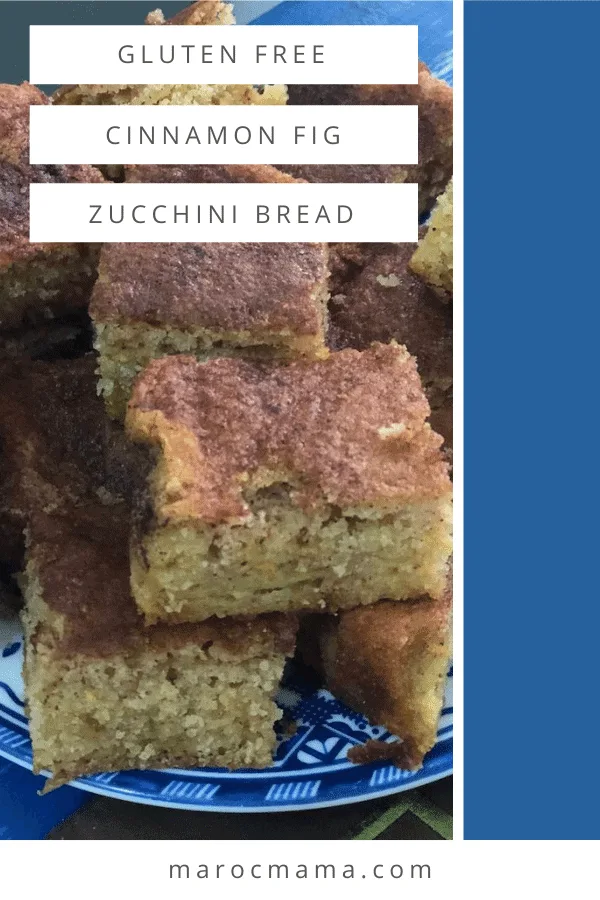 Image of piled pieces of zucchini bread with a brown cinnamon topping on a blue and white plate. 