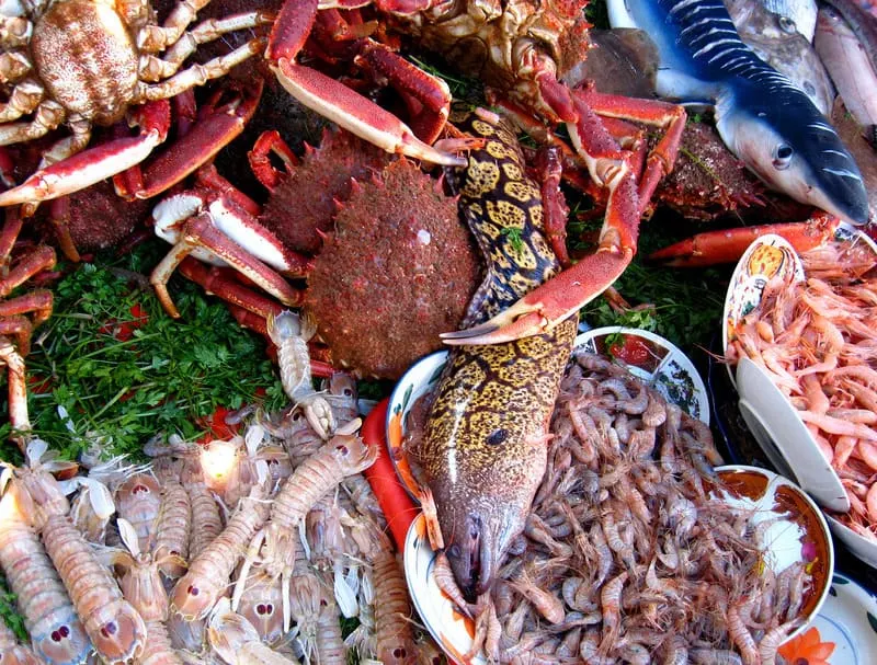 Table with a variety of seafood for sale