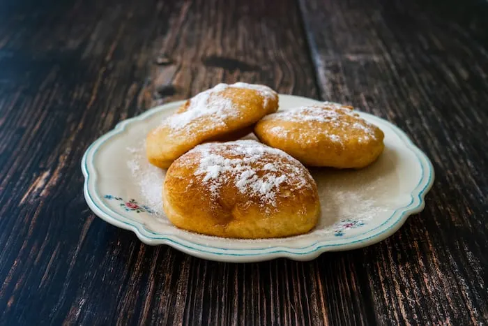 Tanzanian fried doughnuts on a white plate. 