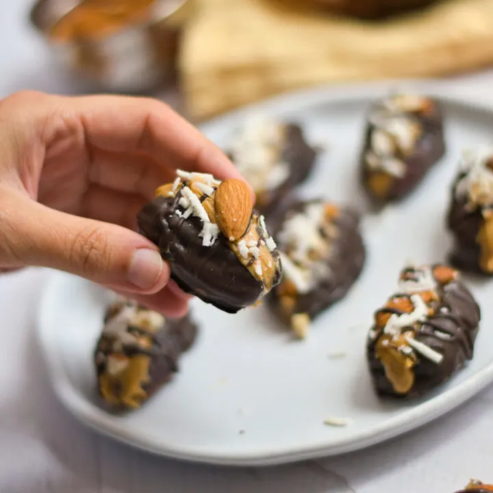 Peanut butter stuffed medjool dates on a plate