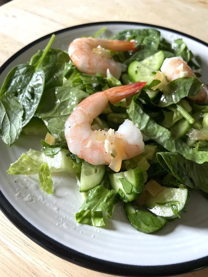 plate with green salad and shrimp