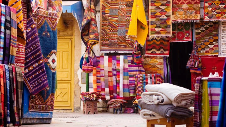 Street in Morocco with rugs draped on the walls