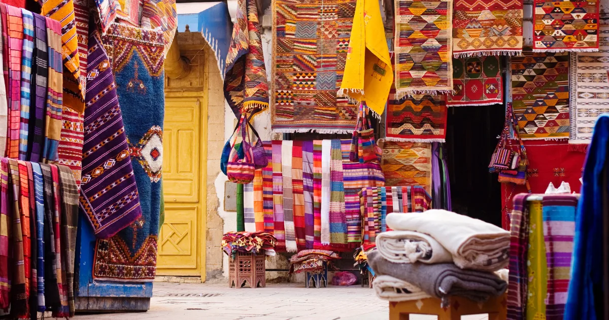 Street in Morocco with rugs draped on the walls