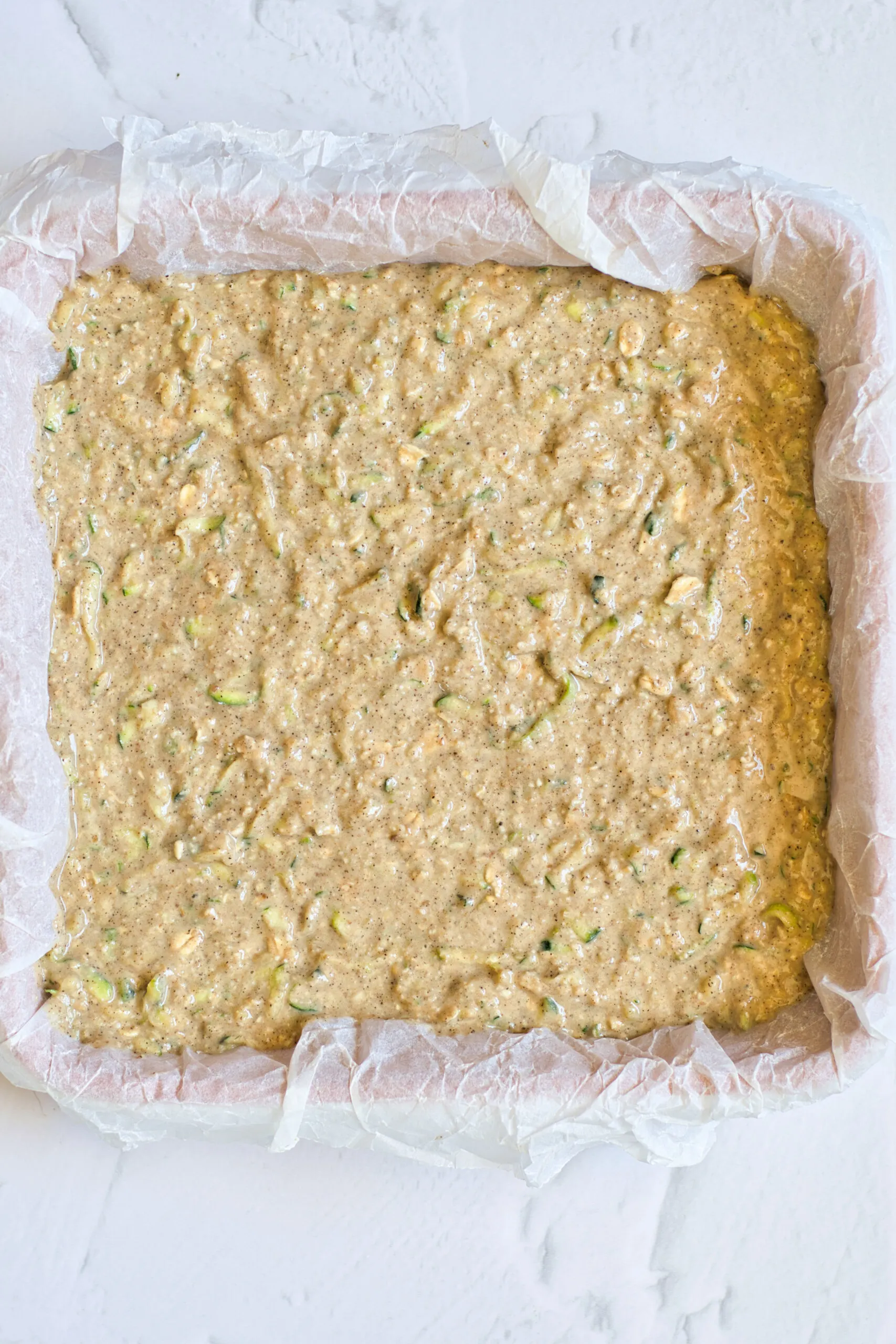 cinnamon zucchini bread batter in a baking pan