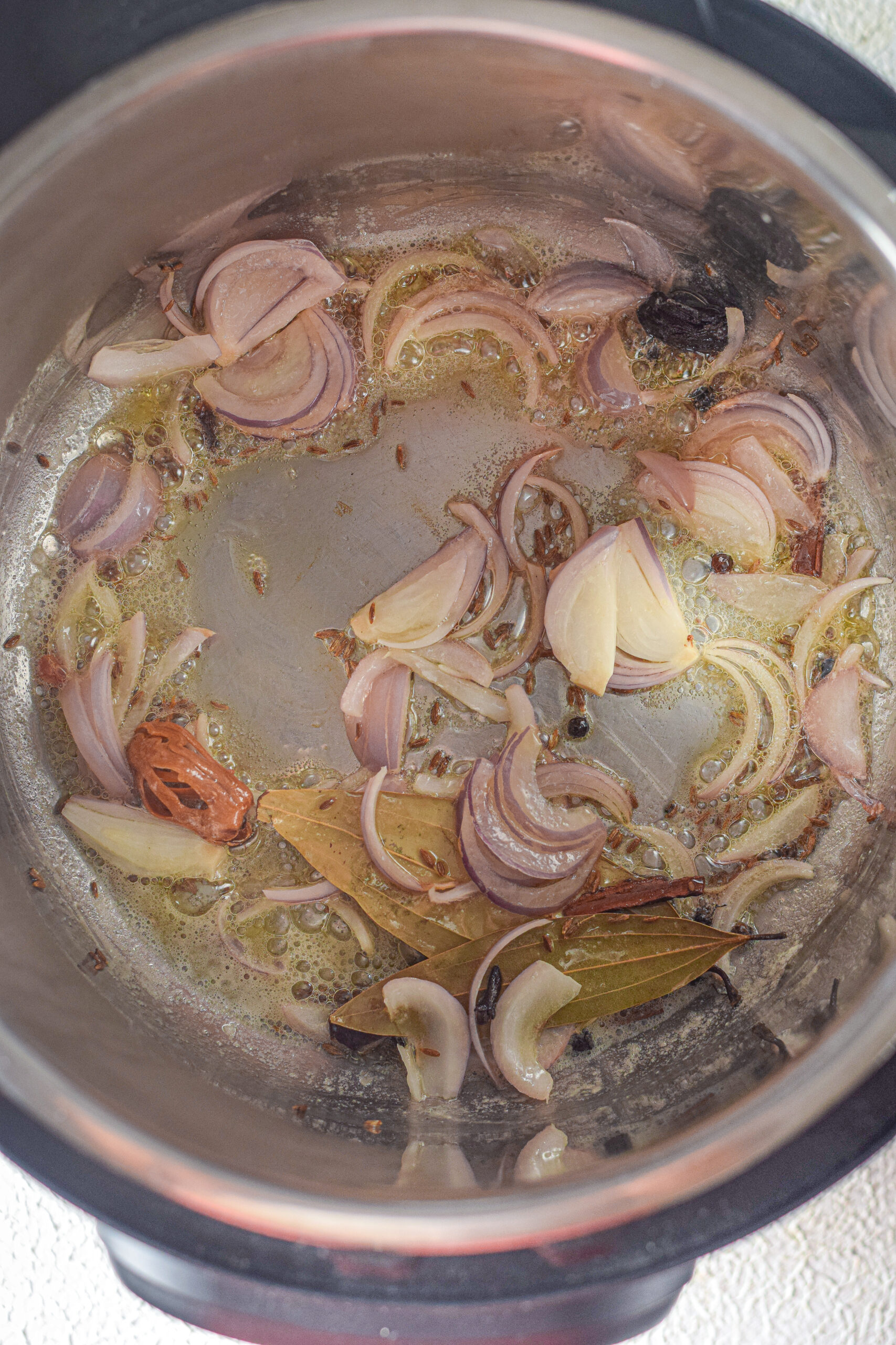 sliced onion with other ingredients of biryani recipe
