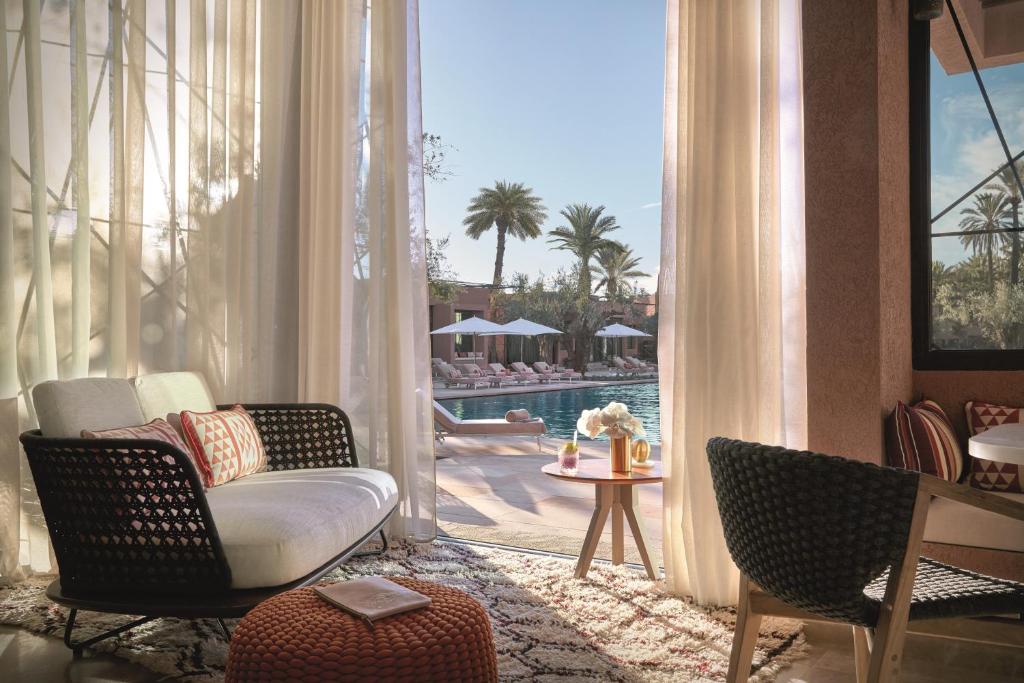 a room with pool outside at Royal Mansour good for luxury Morocco honeymoon
