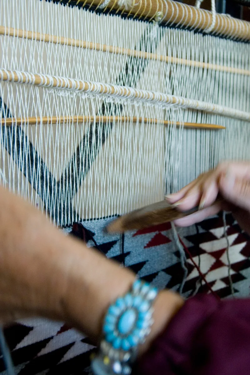 a person making a new rug or vintage rug