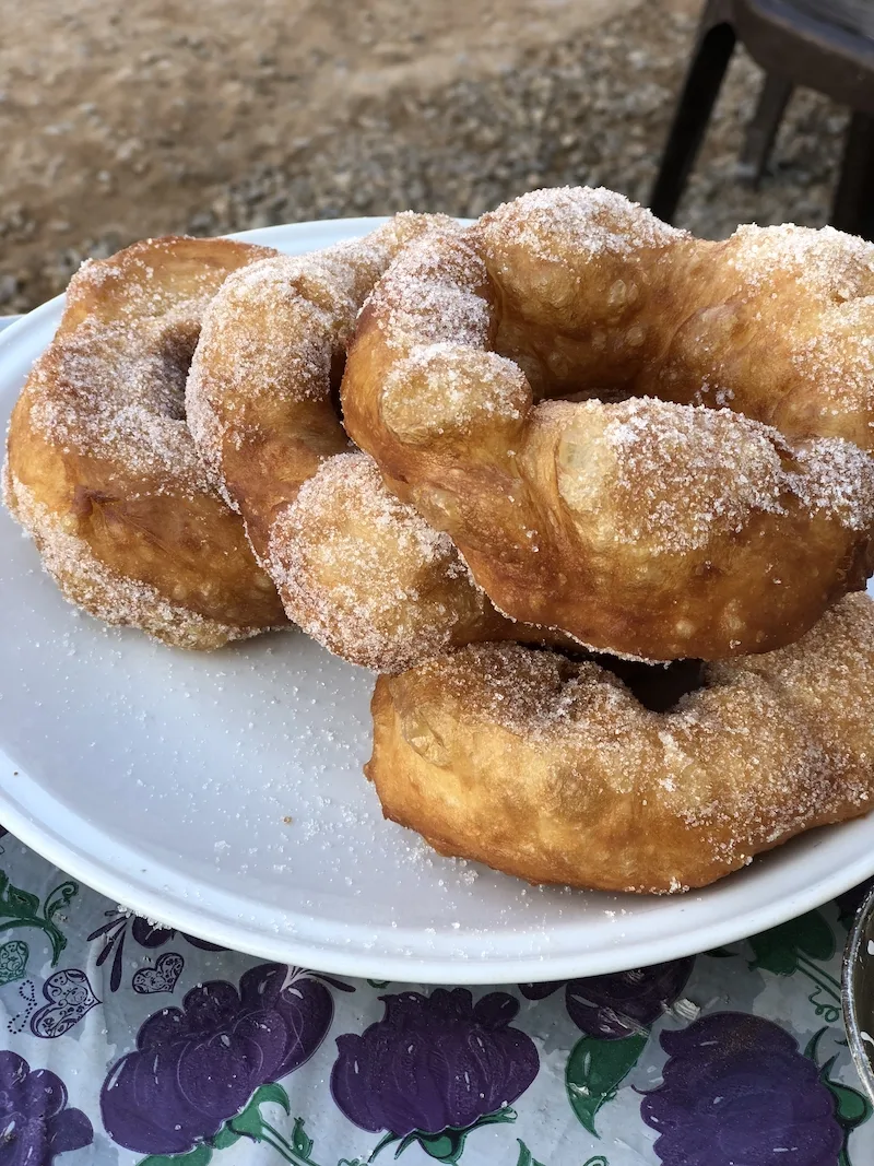 Plate with three Moroccan doughnuts on top.