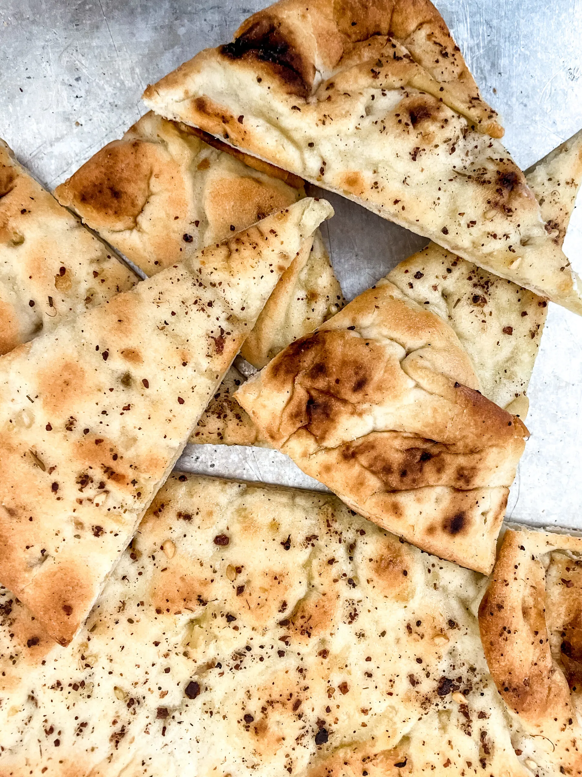 Naan bread cut into wedges