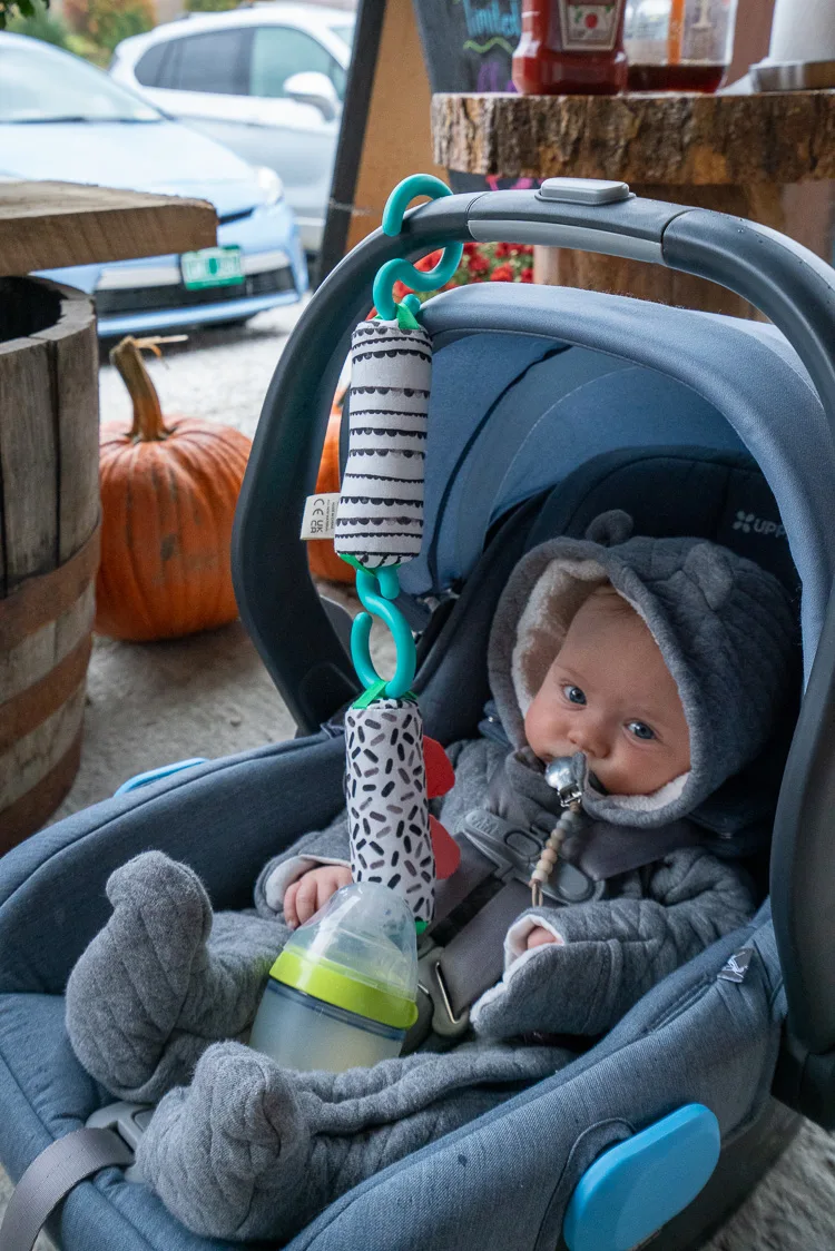 a baby in a convertible car seat a thing that is necessary to survive an international flight with a baby