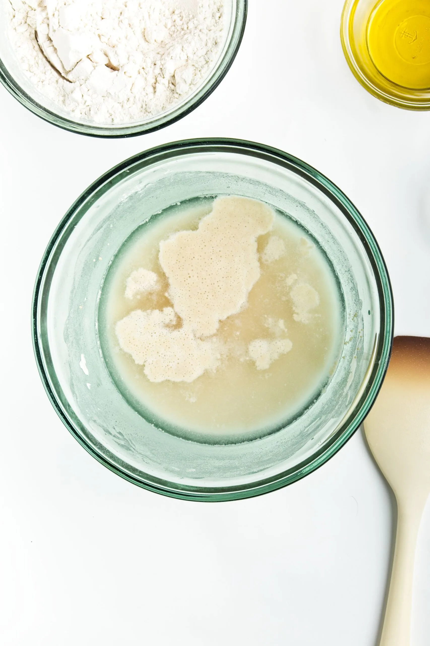 warm water, flour, and yeast in a bowl