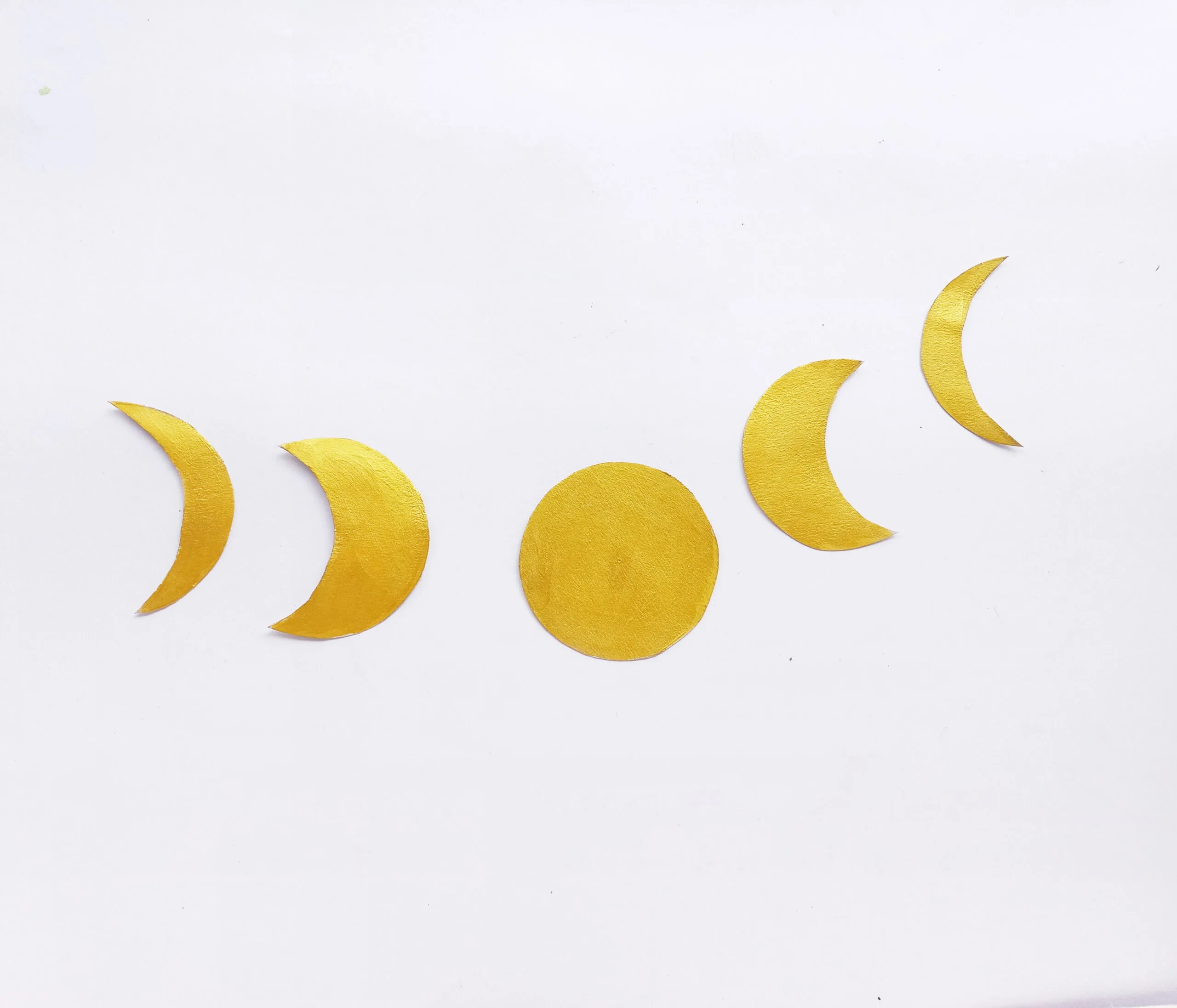 moon cut out with golden paint