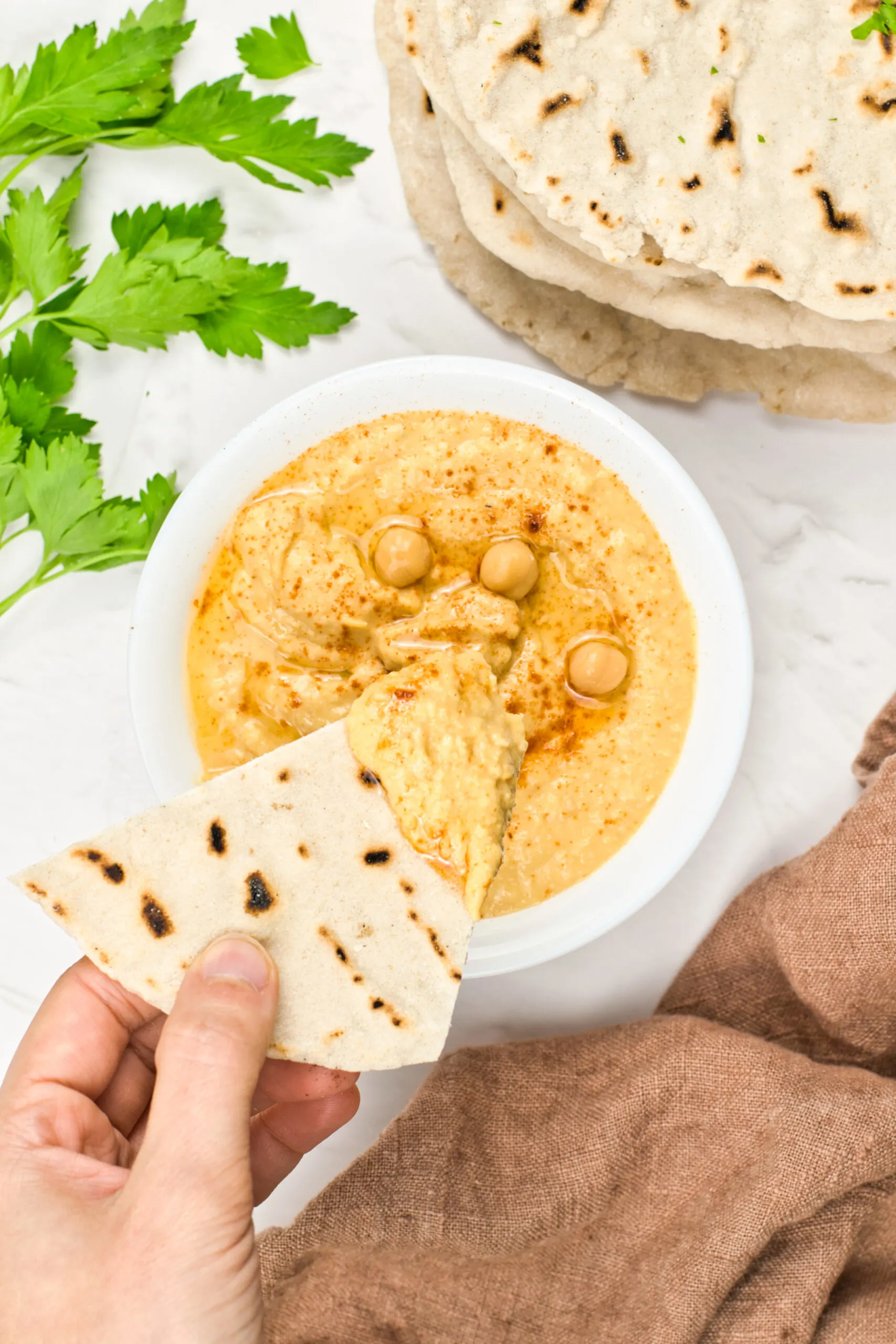 gluten free pita bread dip in a sauce