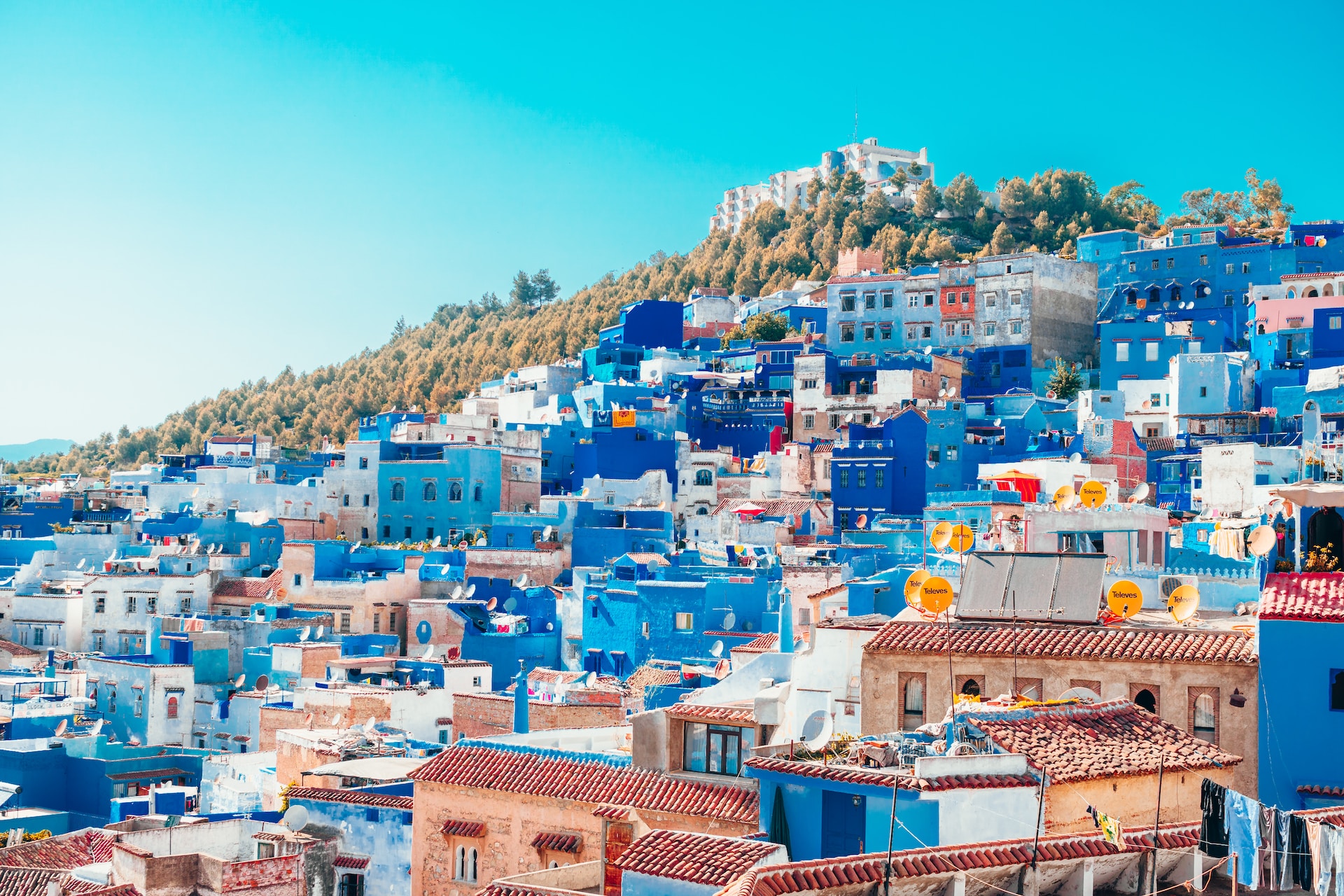 blue and white painted houses on the cliff in Chefchaouen, Morocco