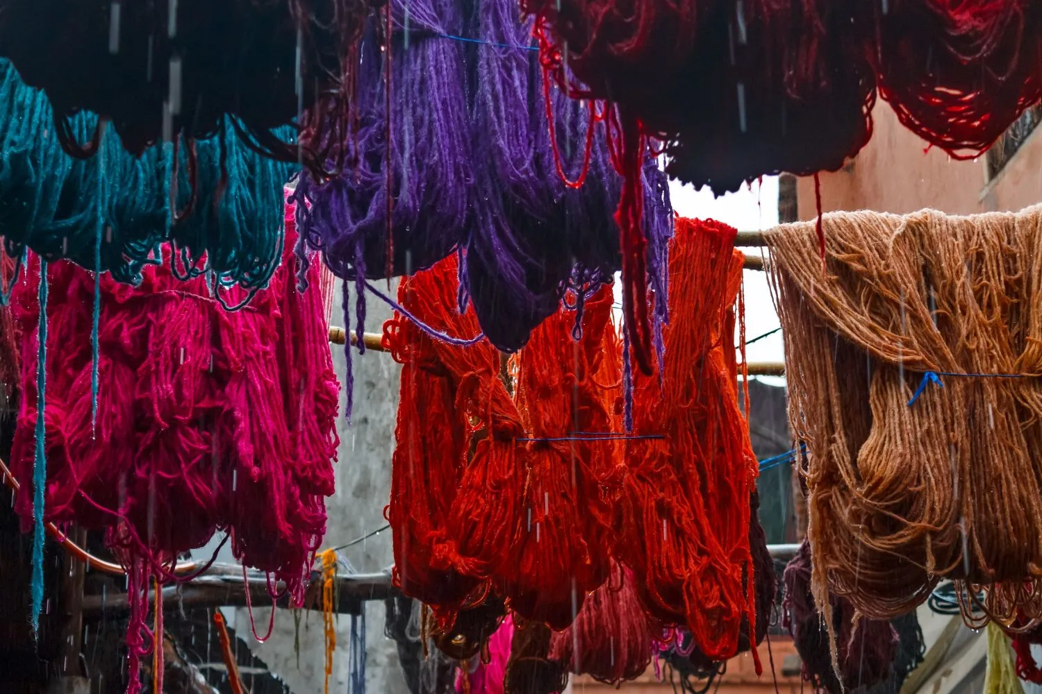 Colored dyed yarn is dried on the streets of Morocco