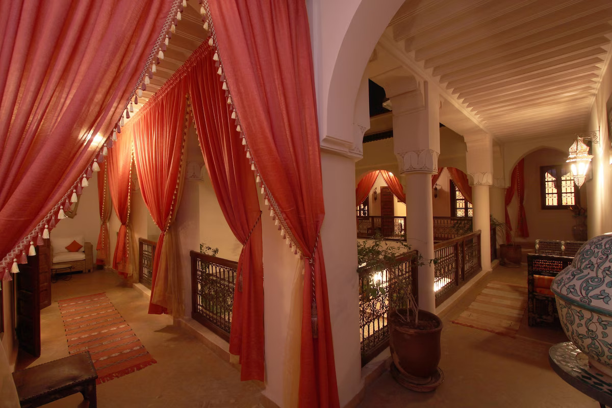 Interior of Riad Cannelle with red draped curtians
