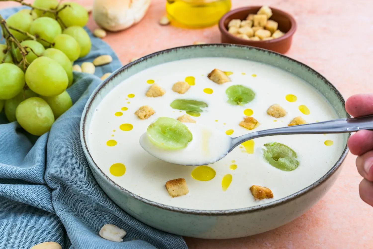 Ajo blanco served in a green bowl 