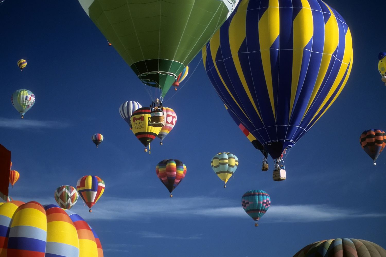Tourists ride hot air balloons
