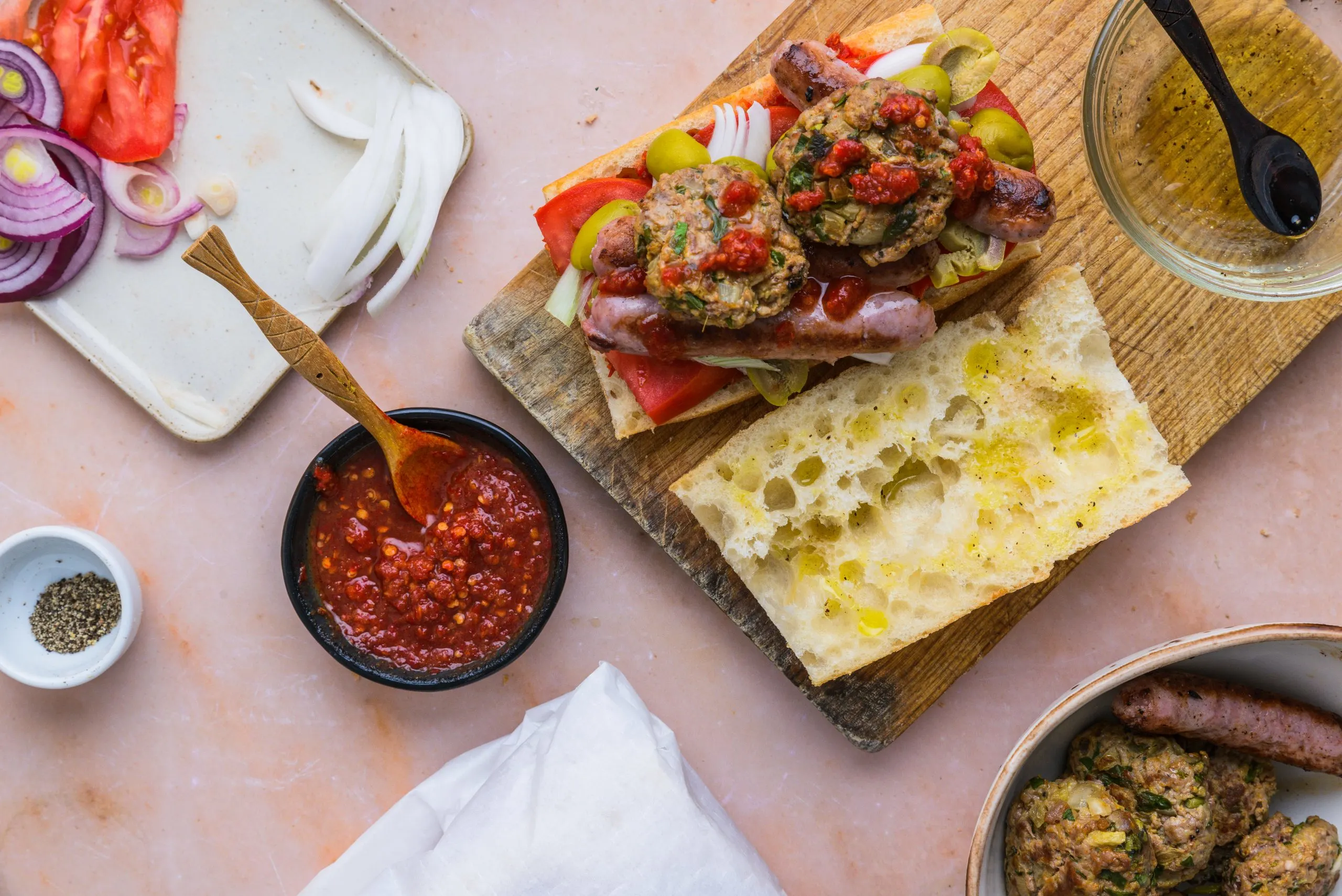 Bocadillo topped with spiced ground meat