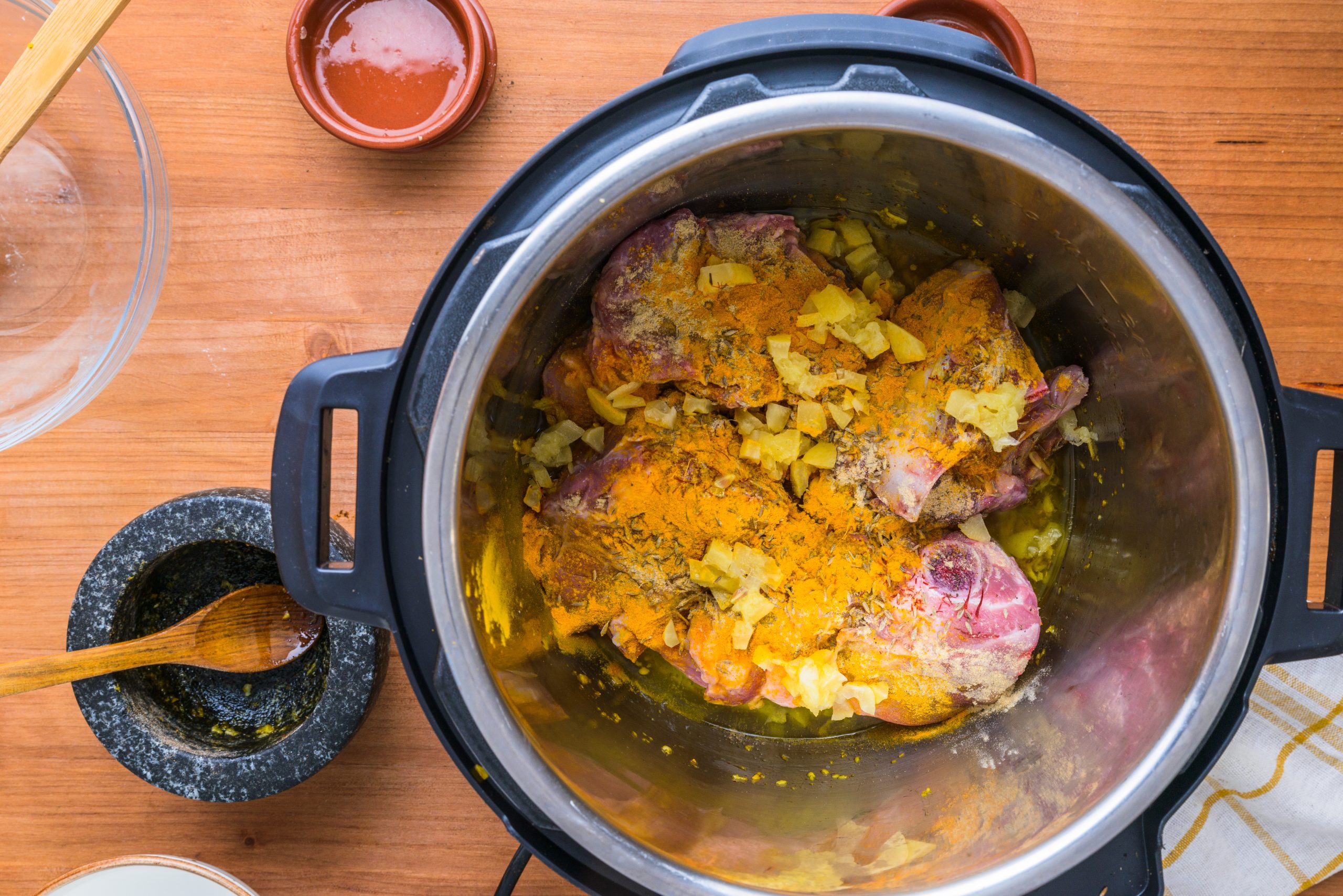 The meat is mixed in with spices in a slow cooker for the Marrakechi Tangia recipe