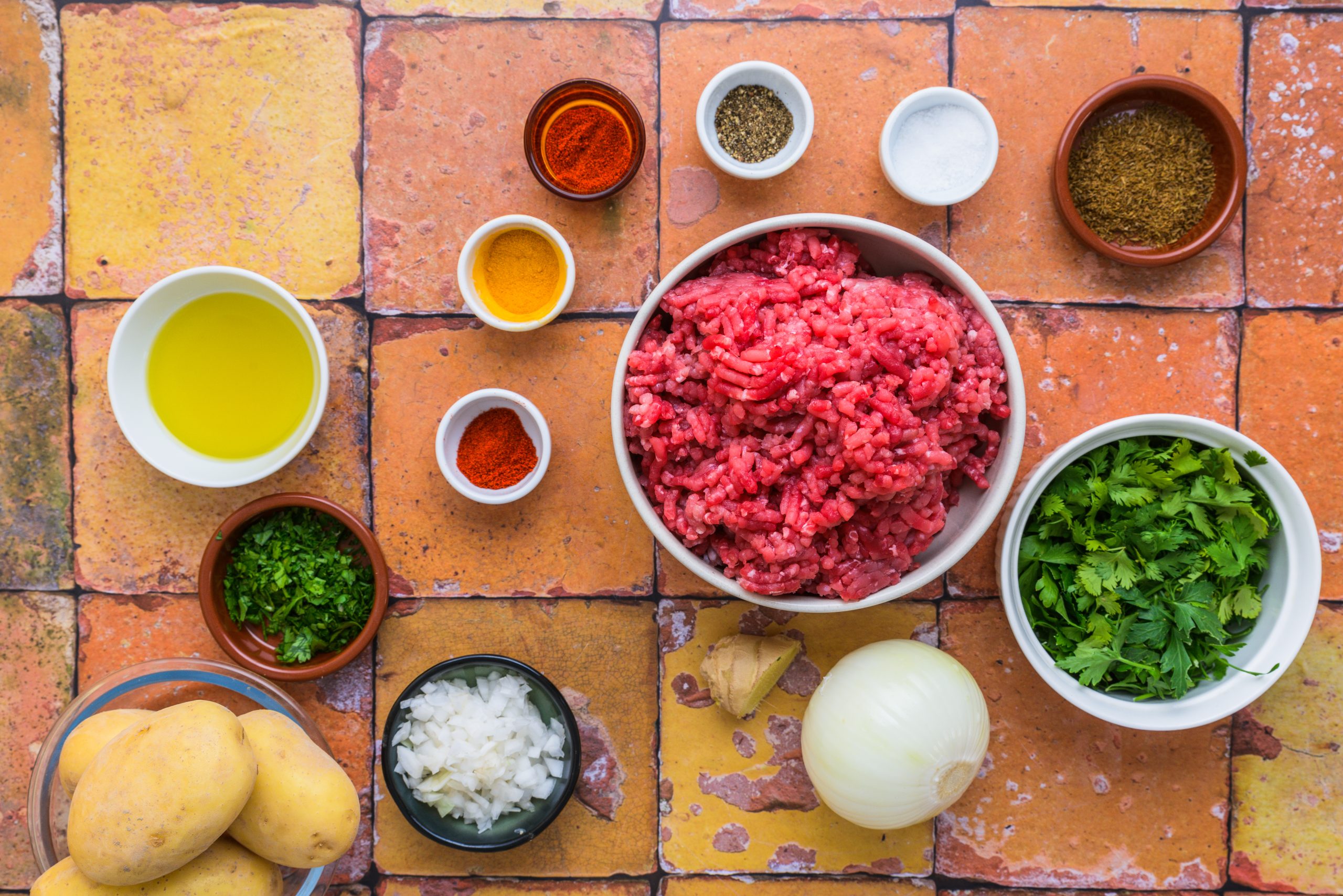 Ingredients in making Moroccan kefta and potatoes