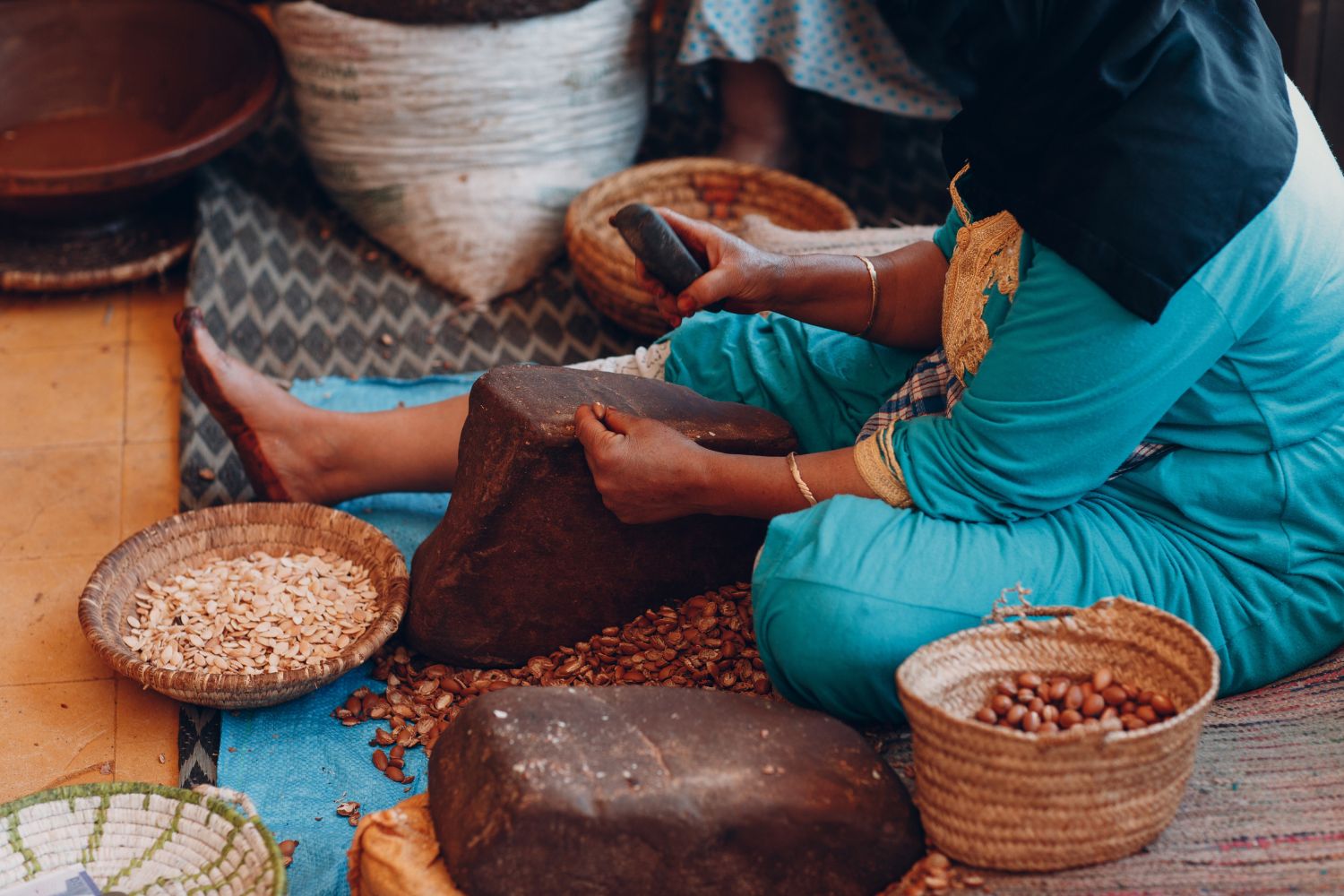 A woman making argan oil by hand