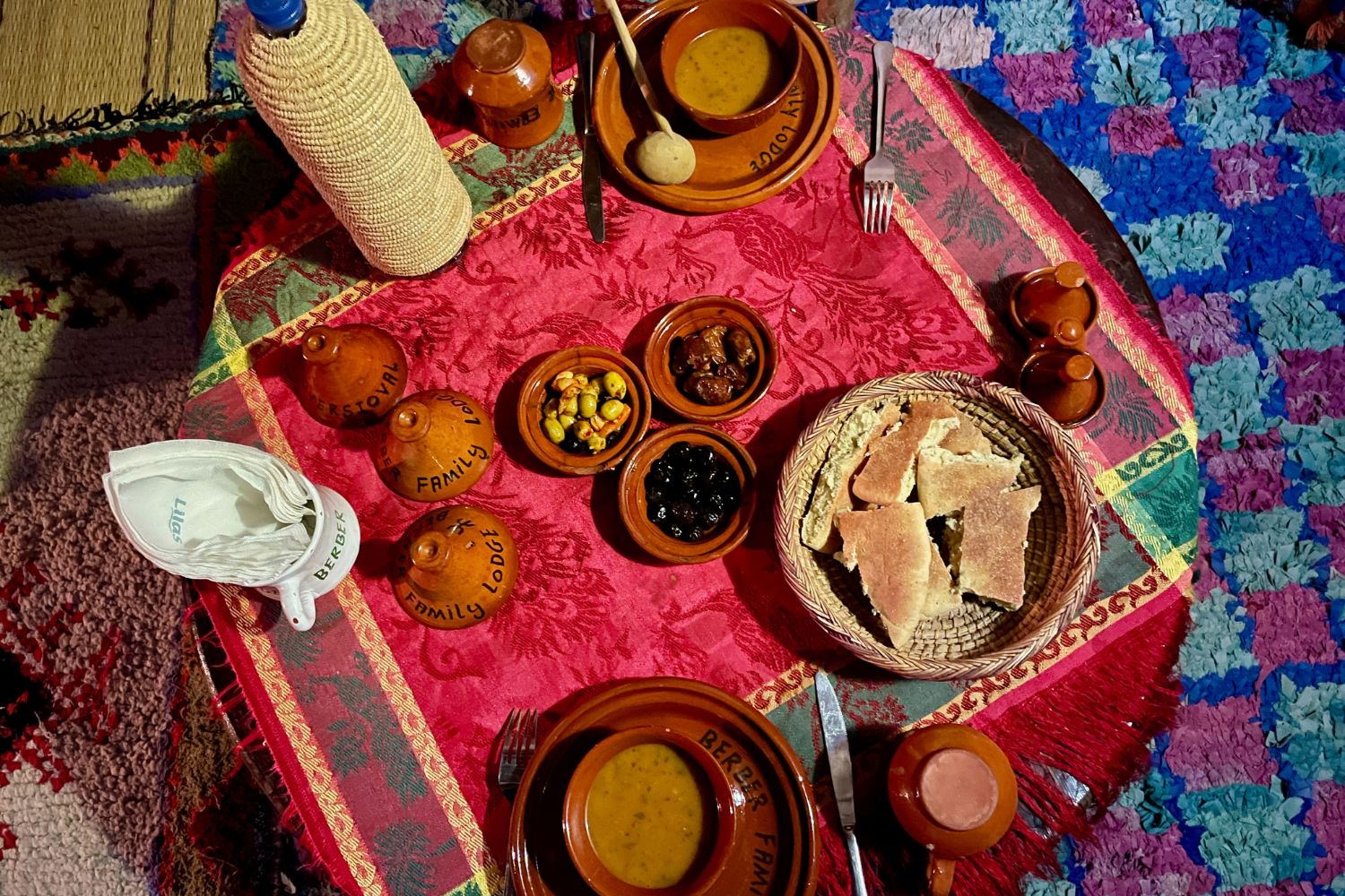 Delicious Moroccan dinner on beautifully decorated rooftop terrace at Imlil, Morocco.