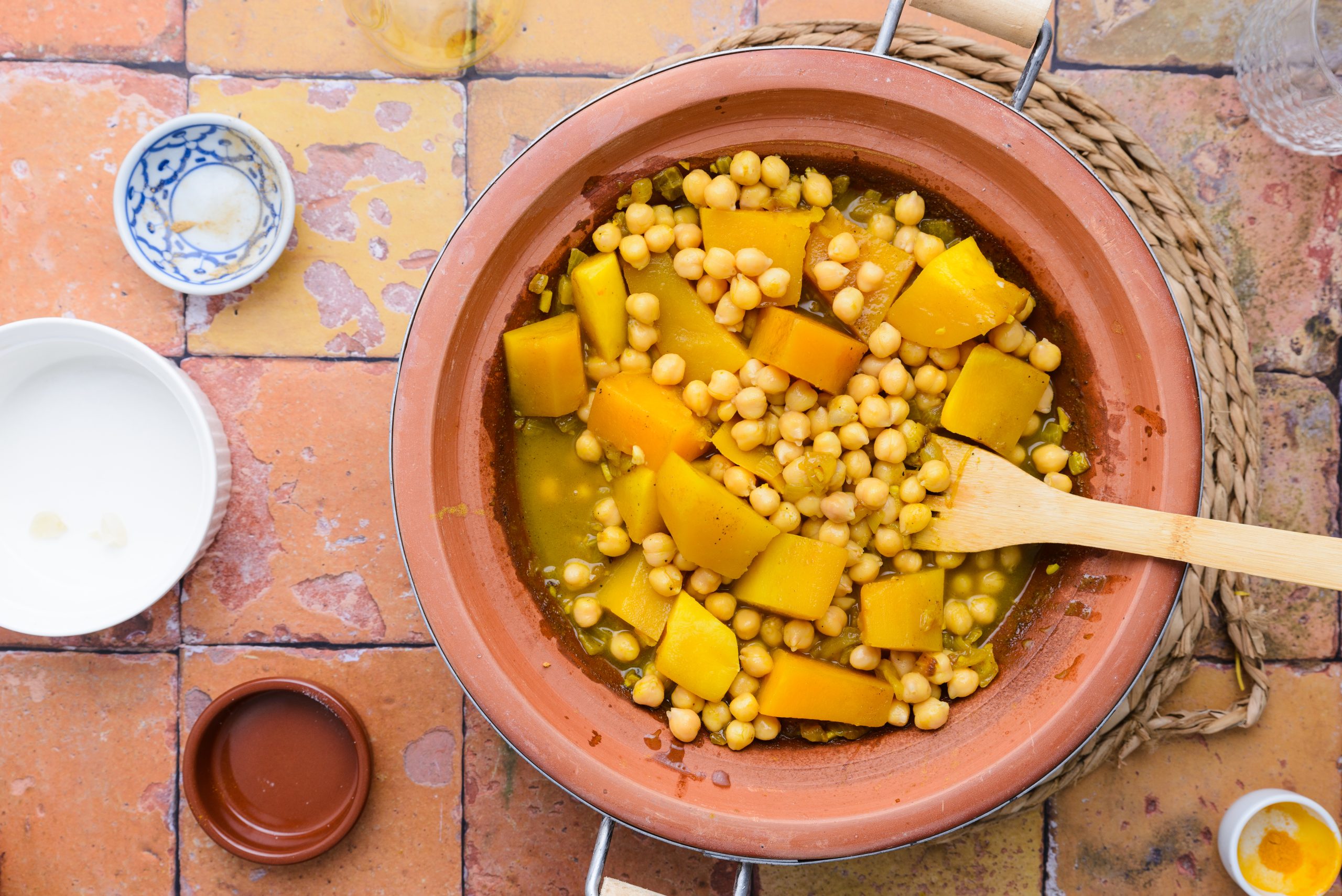 Mixing all the ingredients in making Moroccan pumpkin and chickpea tagine