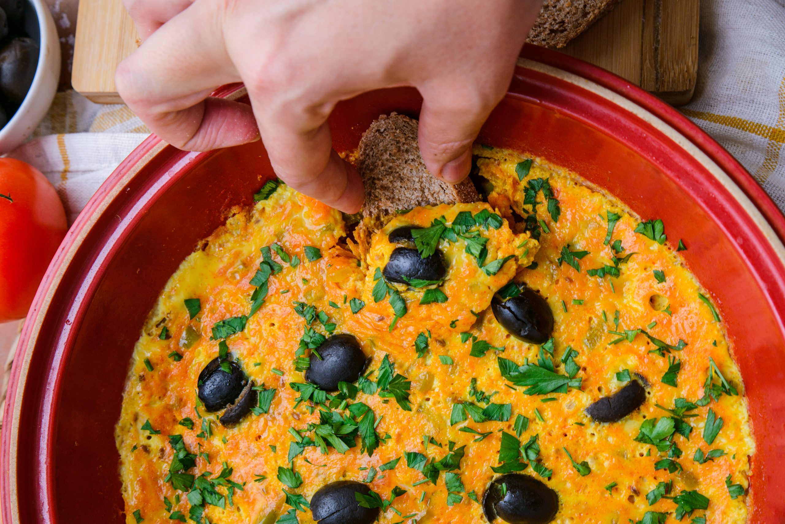 Eating the Moroccan Berber omelette with bread