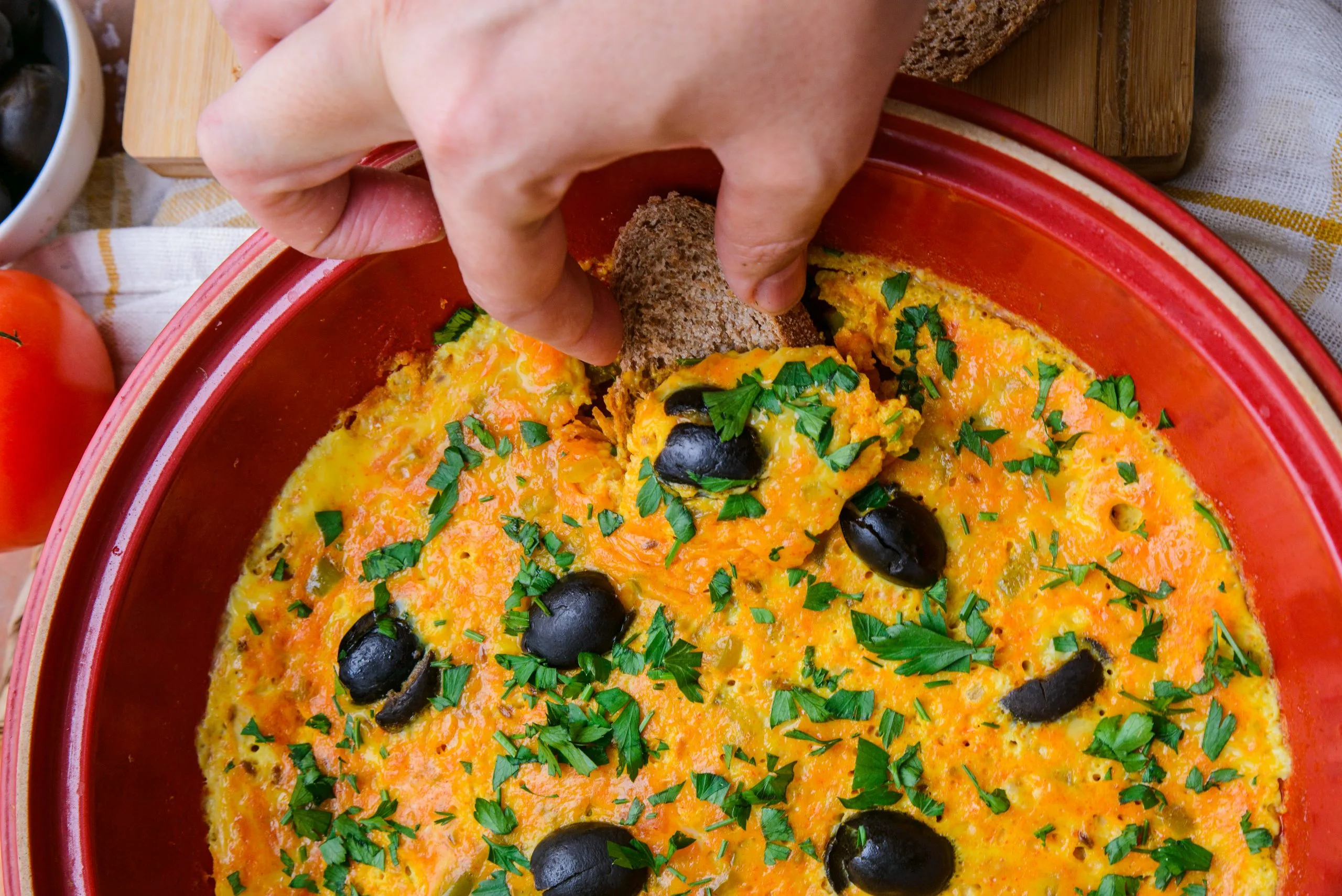 Eating the Moroccan Berber omelette with bread