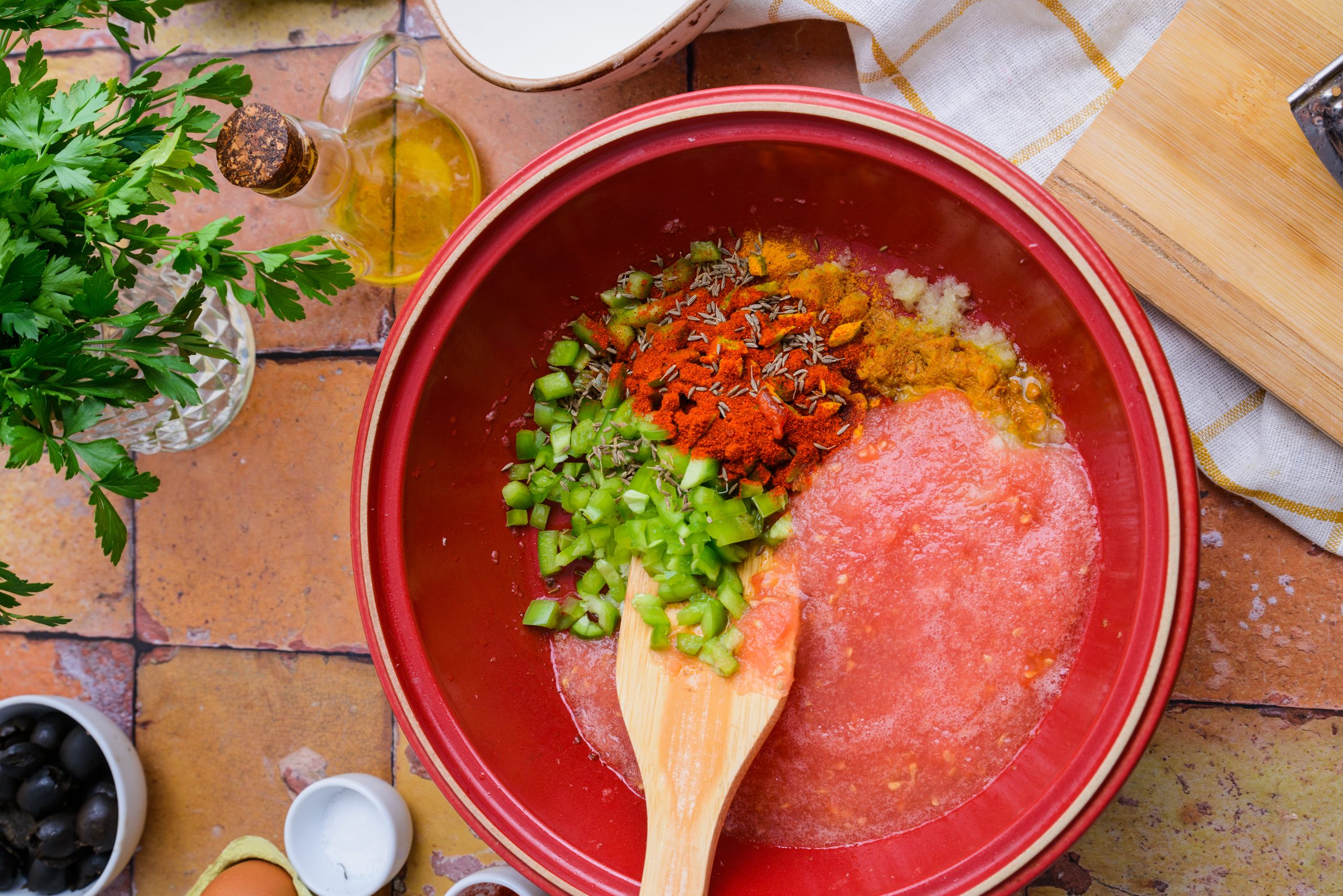 Mixing the ingredients to make Moroccan Berber omelette in a plate